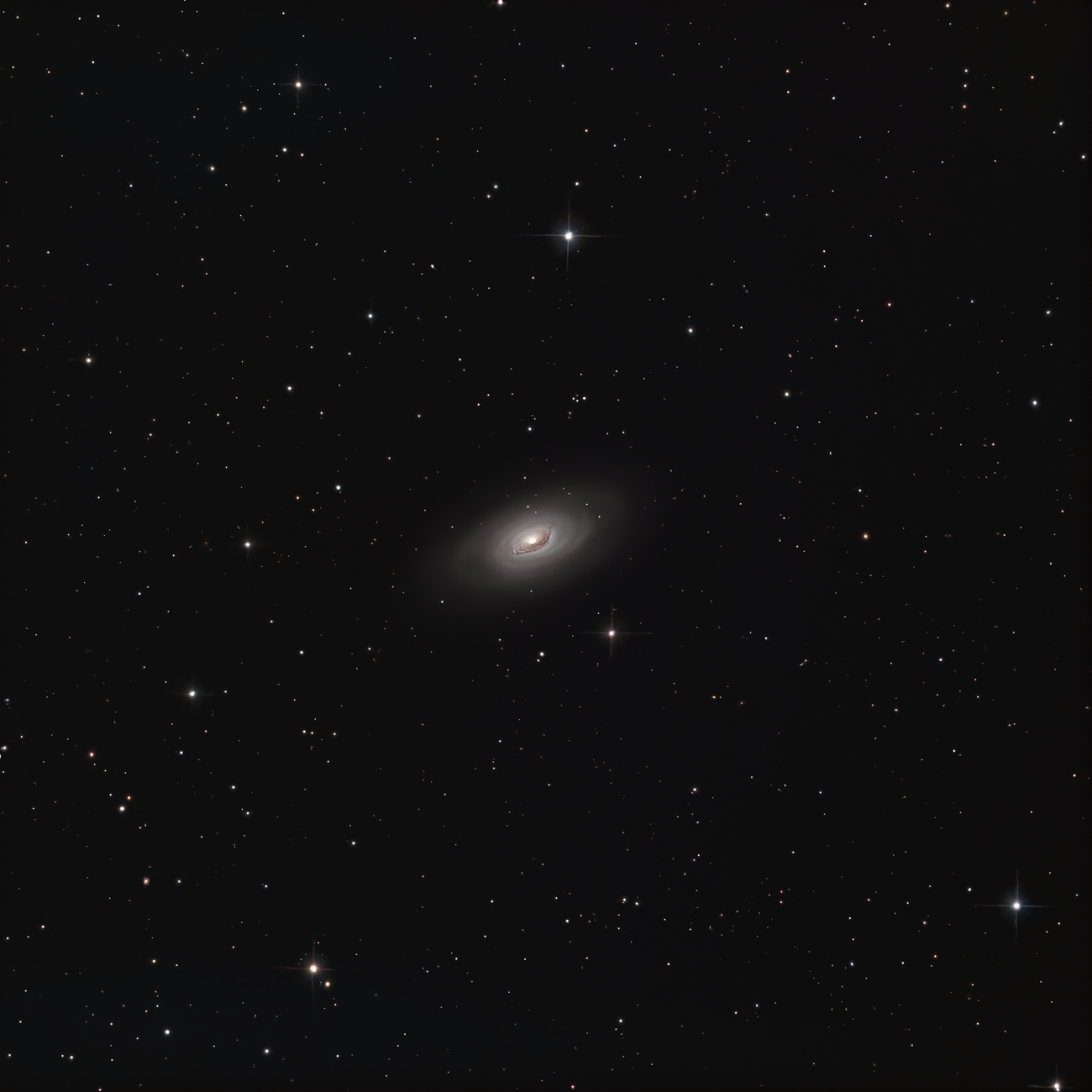 Spiral galaxy surrounded by stars in deep space